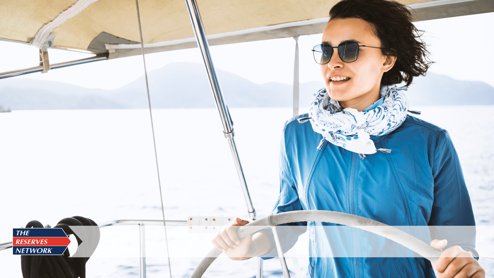 woman steering a boat symbolizing a candidate navigating interviews to assess company culture